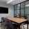 a room with a table and chairs