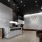 a room with a fireplace and a stone wall