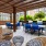 a patio with chairs and tables