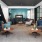 a living room with blue couches