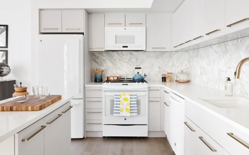 a kitchen with white cabinets