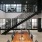 a room with a staircase and tables