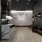a room with a couch and chairs
